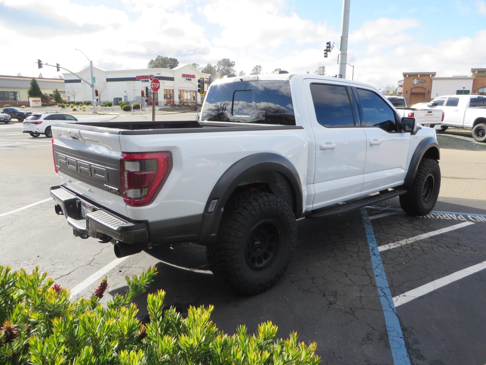 2023 White /BLACK Ford F-150 Raptor SuperCrew 4WD (1FTFW1RG6PF) with an 3.5 V6 engine, 6A transmission, located at 2630 Grass Valley Highway, Auburn, CA, 95603, (530) 508-5100, 38.937893, -121.095482 - Raptor sitting on Eibach front and rear springs, 37" Nitto Ridge Grappler tires, 17" Method NV wheels, and window tint. - Photo #4